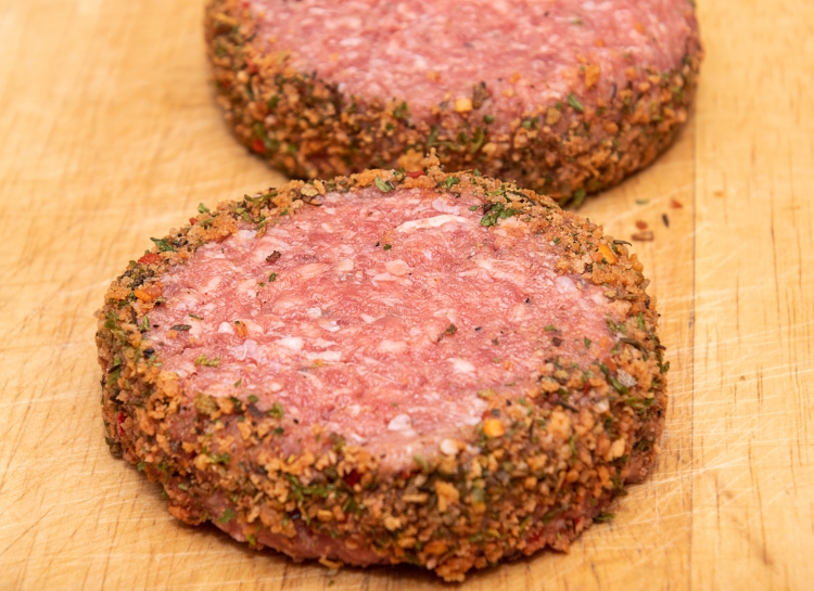 two-fresh-raw-lamb-burgers-wooden-chopping-board.jpg